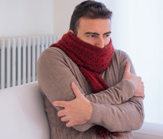 a man freezing inside house